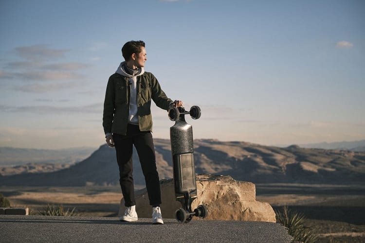 Man Holding Electric Skateboard