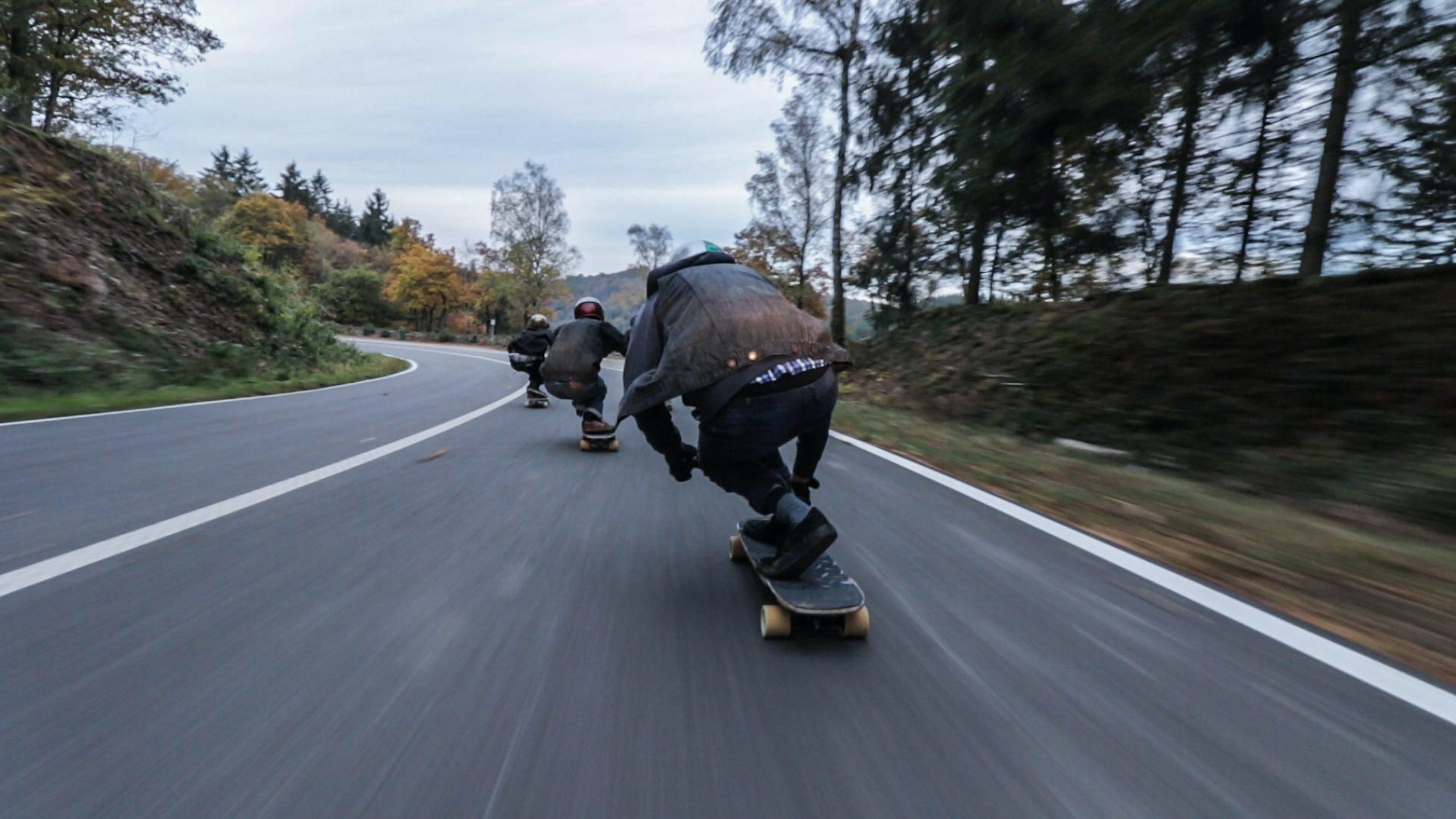 Racing down hill on electric skateboards