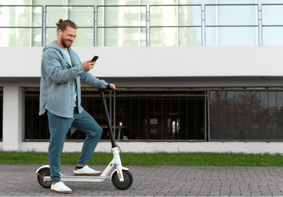 on a scooter checking phone