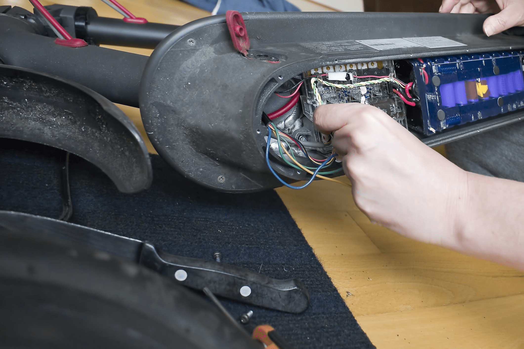 checking the battery of an electric scooter