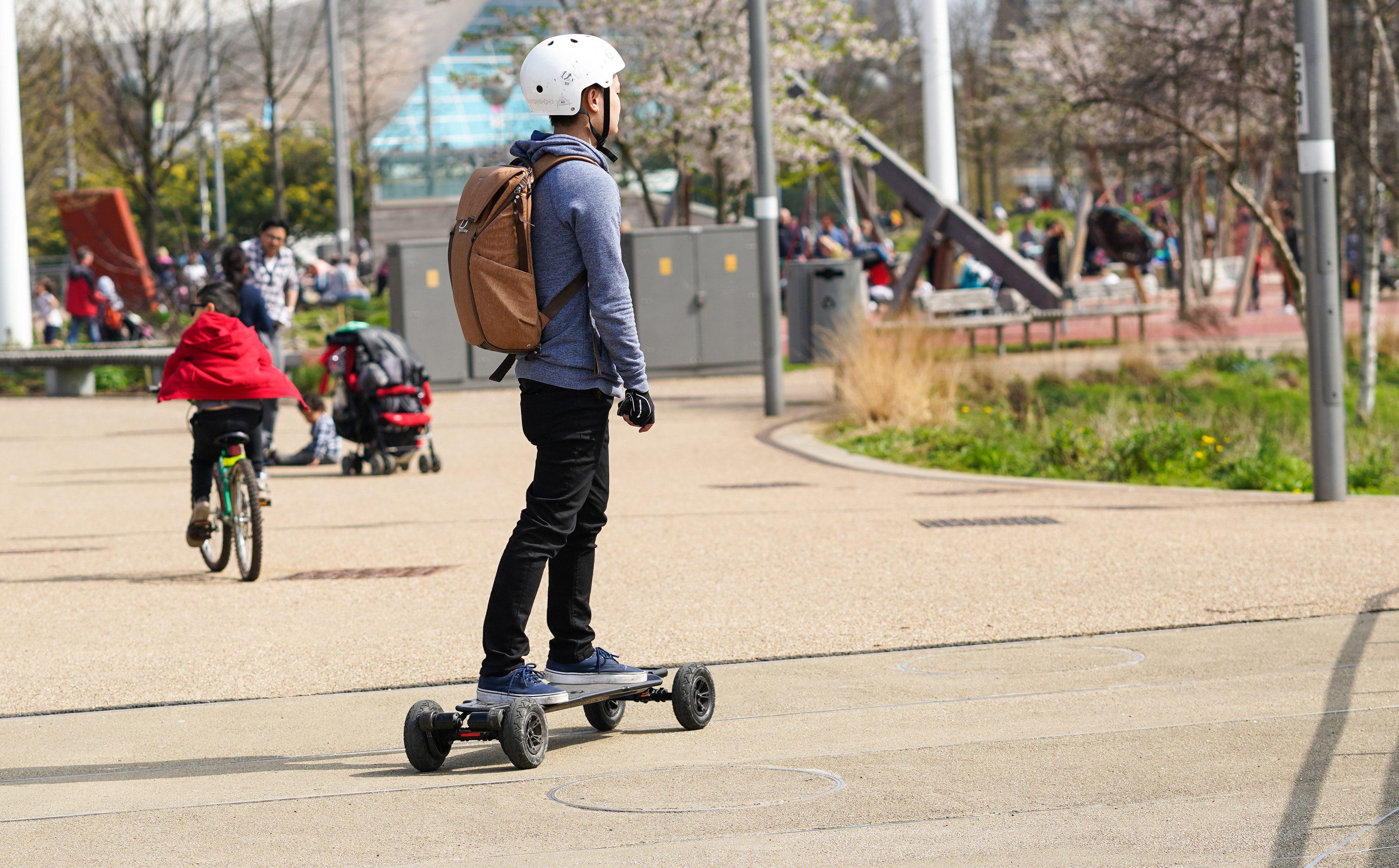 Man riding electric skateboard